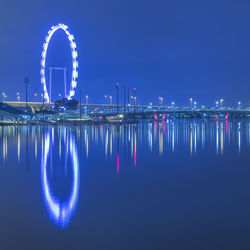 Reflection of illuminated buildings in water at night