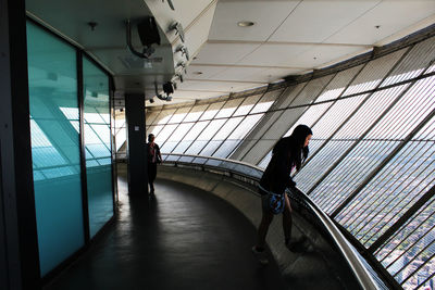 Full length of man standing on escalator