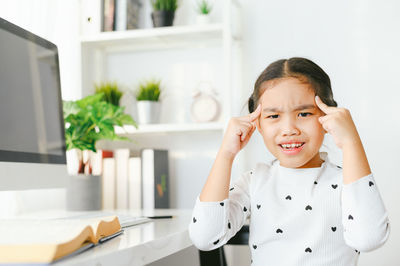 Portrait of smiling girl at home