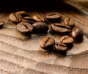 Close-up of coffee beans on table