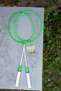 Green badminton rackets on the table. outdoor sports, active recreation. view from above. 