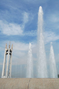 Low angle view of fountain against sky