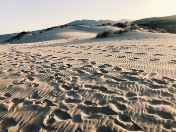 Scenic view of desert against clear sky