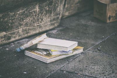 Abandoned books on footpath
