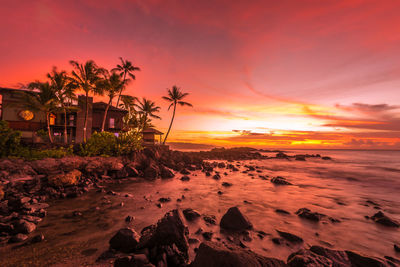 Scenic view of rocks at sunset