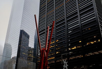 Low angle view of modern buildings in city at night