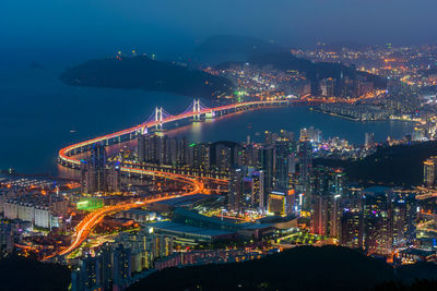 High angle view of illuminated buildings in city at night