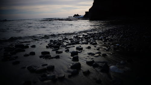 Scenic view of beach against sky during sunset