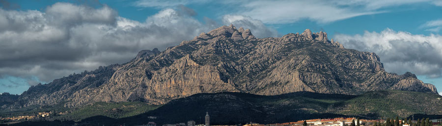 Panoramic view of mountain range against sky