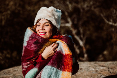 Portrait of a smiling young woman during winter