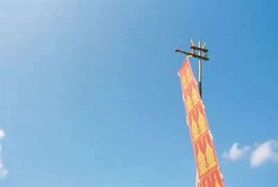 Low angle view of statue against clear blue sky