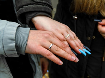 Hands of just married with wedding rings