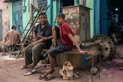 Portrait of friends sitting outdoors