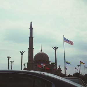 Low angle view of built structure against cloudy sky