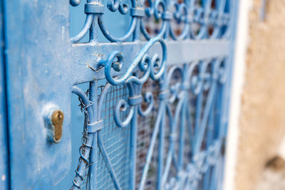 Close-up of blue metal gate