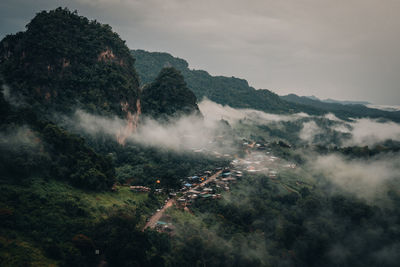 High angle view of trees on land against sky