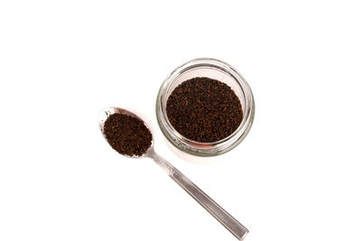 Directly above shot of coffee beans on white background