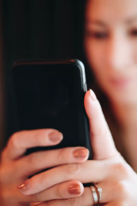 Midsection of woman using mobile phone