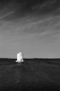 Building by sea against sky