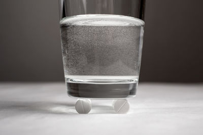 Close-up of drinking glass on pill