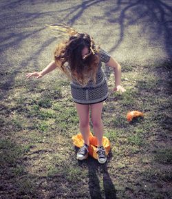 Full length of woman standing on field