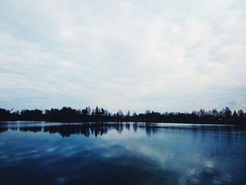 Reflection of clouds in calm lake