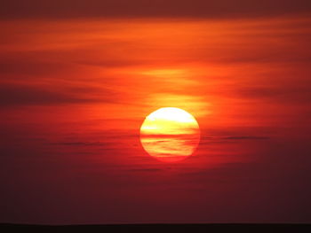 Scenic view of sea against romantic sky at sunset