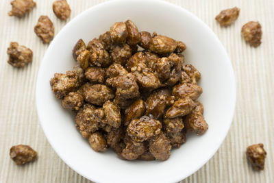 Directly above shot of roasted almonds in bowl on table