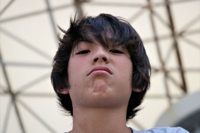 Close-up portrait of grumpy boy 