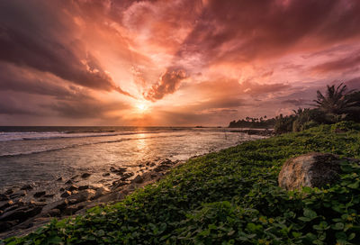 Scenic view of sea against cloudy sky