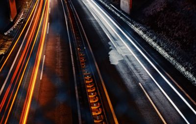 Light trails on road in city at night