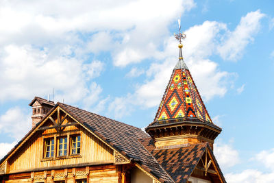 Wooden house with colorful bright roof. country house old rural wooden house in abandoned village 