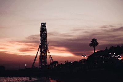 Low angle view of silhouette tower against sky at sunset