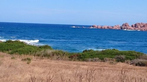 Scenic view of sea against clear blue sky