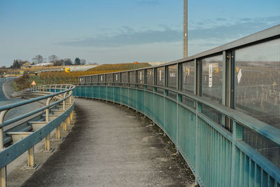 Footbridge against sky