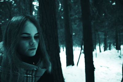 Close-up of young woman in forest