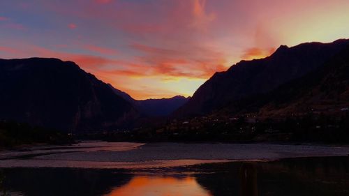 Scenic view of lake against sky during sunset