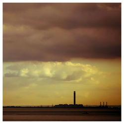 Silhouette of building at sunset