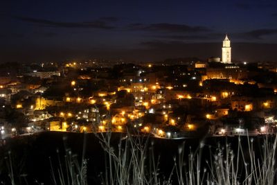 Illuminated buildings in city at night