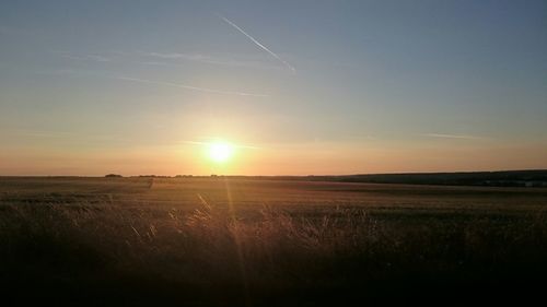 Scenic view of landscape at sunset