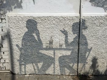 Shadow of people on wall