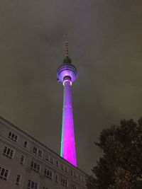 Low angle view of communications tower against sky