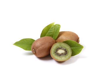 Close-up of fruits over white background