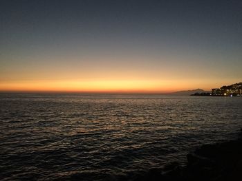 Scenic view of sea against sky at sunset