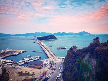 High angle view of sea and city against sky