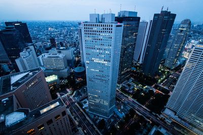 High angle view of modern buildings in city against sky