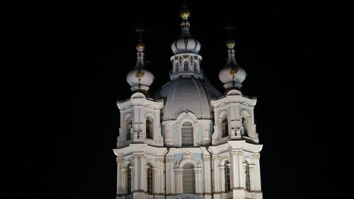 Cathedral against clear sky at night