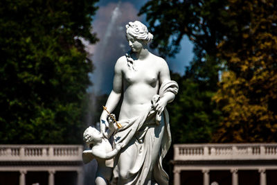 Low angle view of statue against trees