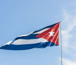 Low angle view of cuban flag against sky