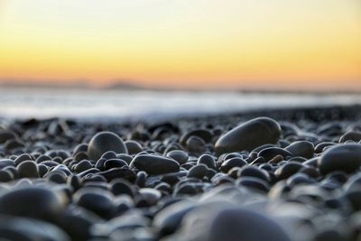 Close-up of sea against sky during sunset